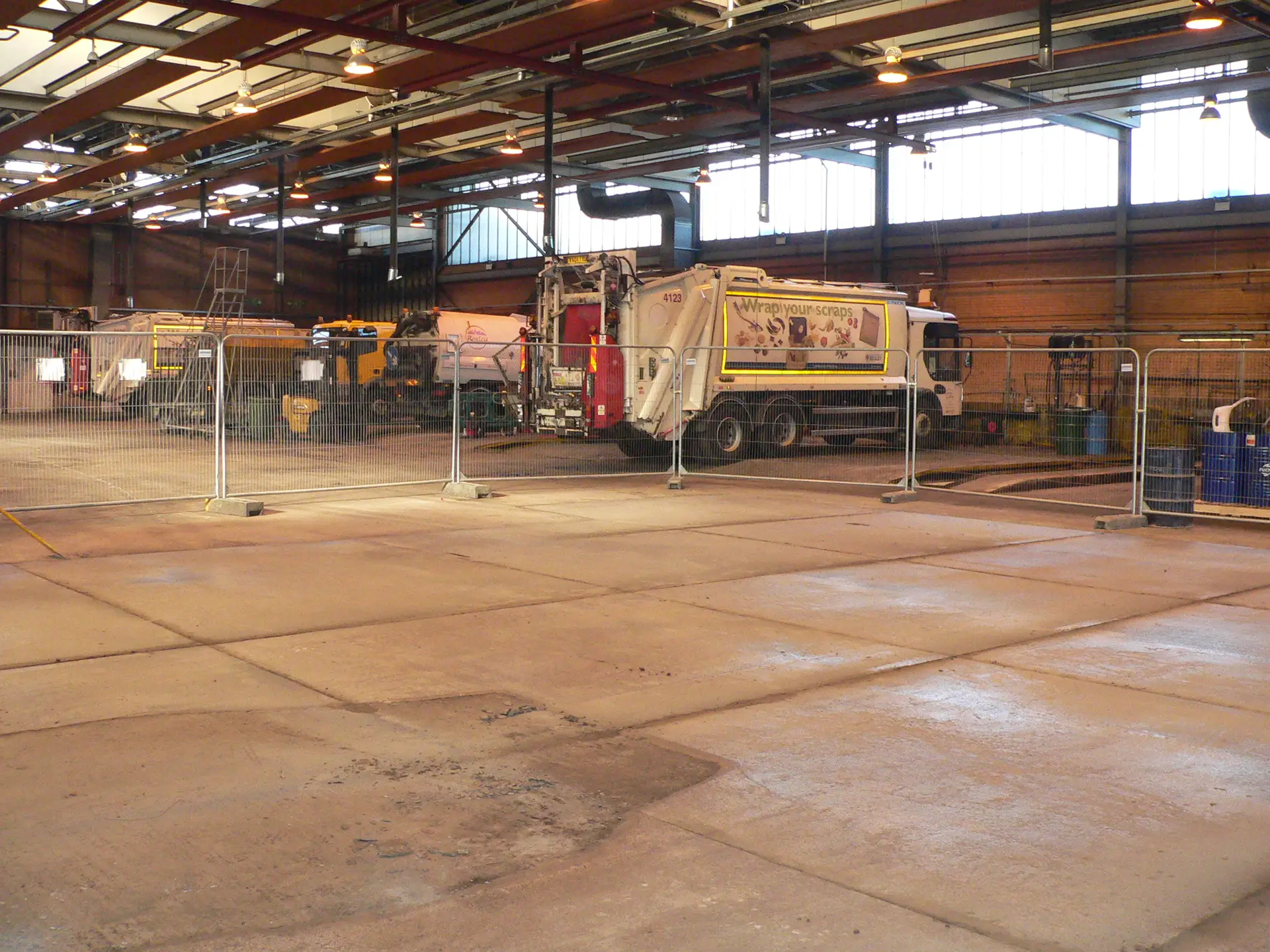 New concrete floor with saw-cut joints in a council lorry depot