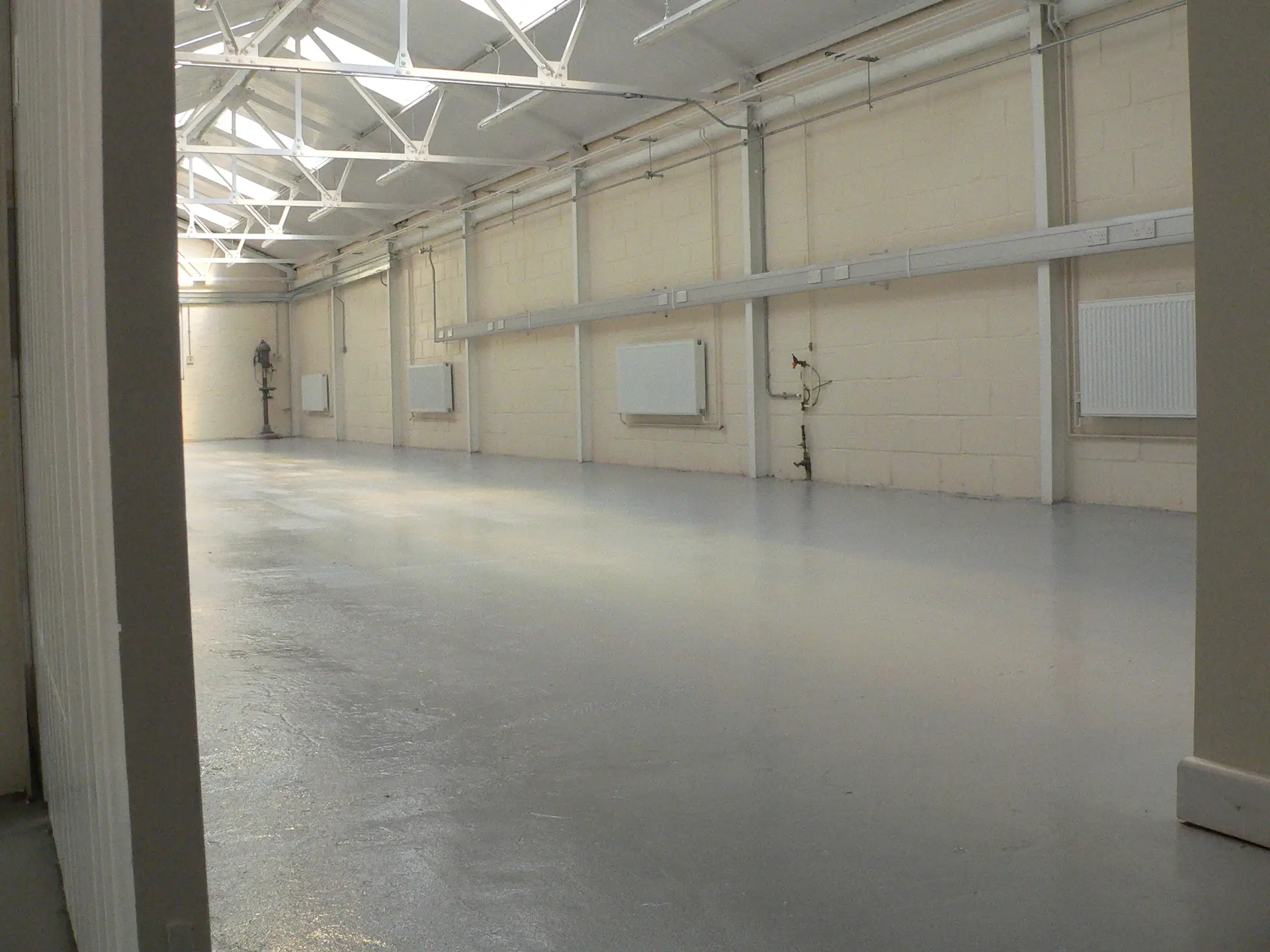A workshop floor after preparation and an epoxy seal