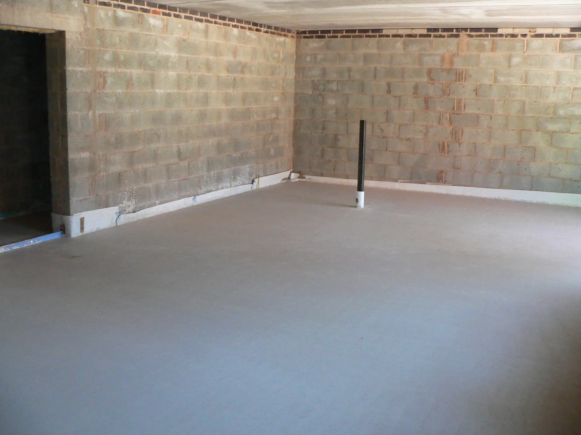 Finished screed over an acoustic floor in an apartment block at Hinckley