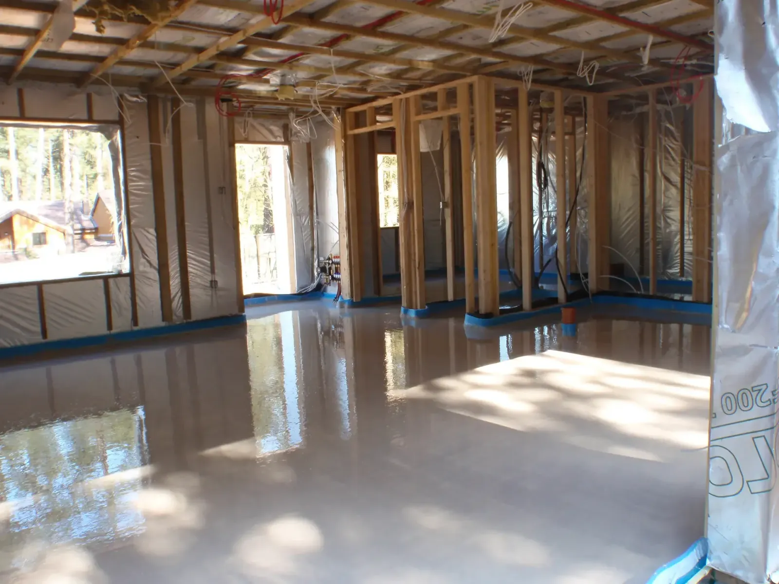 Flowing screed over underfloor heating inside a prototype lodge at Center Parcs