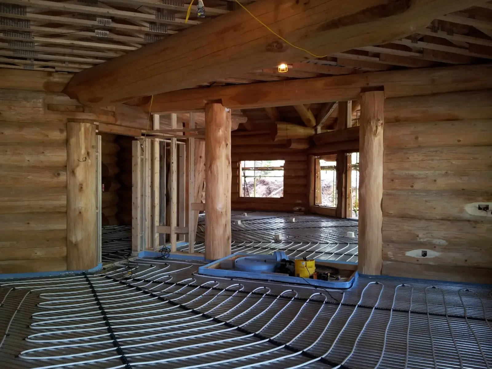 Underfloor heating pipework laid through a Canadian cedar lodge before the screed