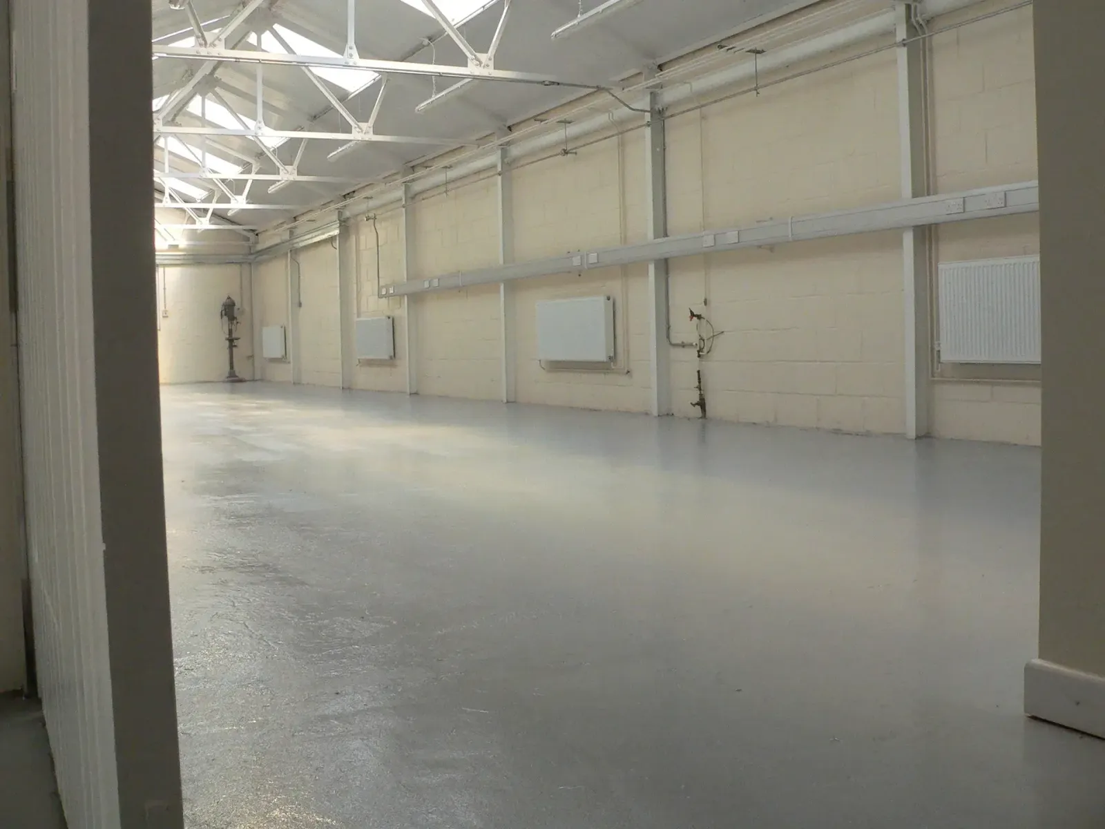 A workshop floor after preparation and an epoxy seal